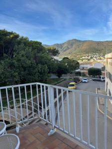 a balcony with a view of a street at La Cantonada in Port de la Selva +5 photos