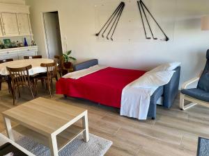 a bedroom with a bed and a table and chairs at Perle de vue in Glaine-Montaigut