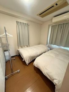 Postel nebo postele na pokoji v ubytování Green House Nakano Fujimicho - Vacation STAY 65278v