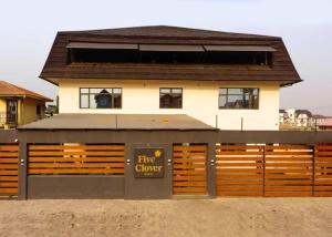 a building with a fire garage in front of it at Five Clover Monastery Road in Lagos