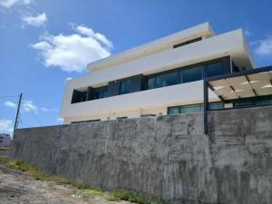 a building on top of a stone wall at MonteCara Apartamento in Lazareto