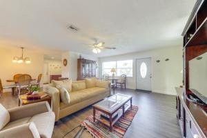 a living room with a couch and a table at Walk to The Cove! Central Deerfield Beach Home in The Cove