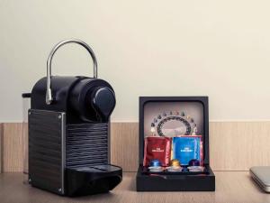 a black box with a suitcase and other items at Mercure Paris la Défense Grande Arche in Nanterre