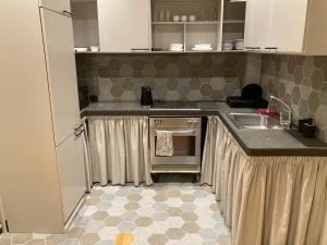 Kuchyň nebo kuchyňský kout v ubytování Avotu ApartHotel `self check-in` + 1 fotografie