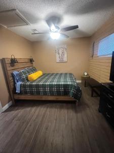 a bedroom with a bed and a ceiling fan at Love Shack on the River in Bullhead City