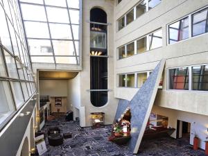 a lobby with a staircase in a building at Mercure Strasbourg Centre Gare in Strasbourg