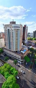an aerial view of a large building in a city at Hotel Metrópole Maringá in Maringá