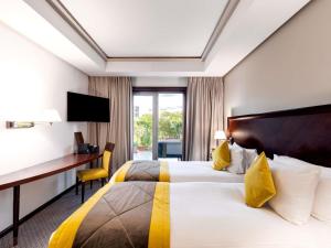 Postel nebo postele na pokoji v ubytování Le Diwan Hotel Rabat - MGallery Collection