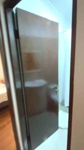 a glass door with a reflection of a bath tub at Vacation rental house La Serena Chile in La Serena