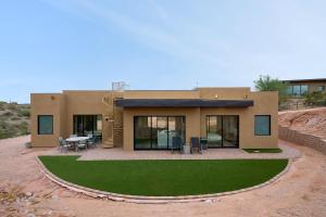 a small house with a lawn in front of it at Scottsdale - 15322 N Sandy Bluff Rd-Casita - LUXE (No Bag) in Fountain Hills