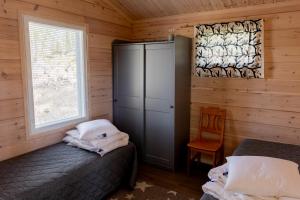 Postel nebo postele na pokoji v ubytování KustaanTähti
