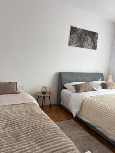 Postel nebo postele na pokoji v ubytování A&N Apartments + 9 fotografií