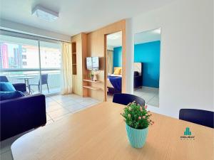 a room with a table and a couch and a bedroom at Beach Class by Holiday Stays in Fortaleza