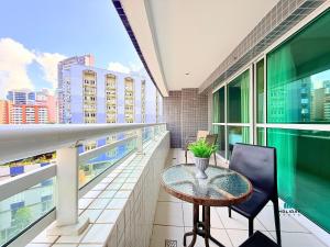 a balcony with a table and chairs on a building at Beach Class by Holiday Stays in Fortaleza