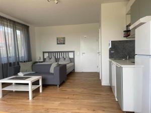 a living room with a couch and a table at Ferienwohnung-Neuwerk in Baltrum