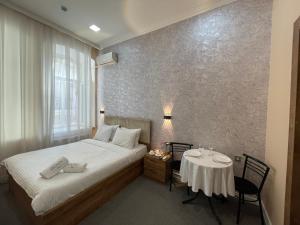 Postel nebo postele na pokoji v ubytování RUNO inn Hotel