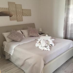 Un pat sau paturi într-o cameră la B&B Corte Salentina
