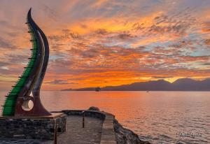 a stairway leading into the water at sunset at Grecian Il in Agios Nikolaos