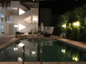a swimming pool in a house at night at Residence Sofia a Santa Maria al bagno con piscina in Nardò