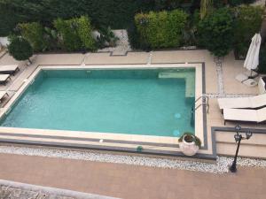 Bazén v ubytování Salento appartamento con piscina nebo v jeho okolí