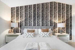 a bedroom with a large bed with two night stands at Closest Walk to Old Town, Entertainment District in Scottsdale +41 photos