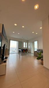 a large living room with a couch and a table at Blue Tao Maison Taormina in Taormina