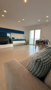 a large living room with a couch and a table at Blue Tao Maison Taormina in Taormina