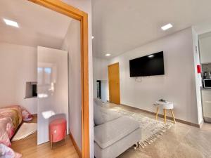 Μια τηλεόραση ή/και κέντρο ψυχαγωγίας στο Casa Dos Passadiços Do Mondego