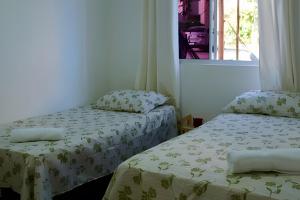 Una cama o camas en una habitación de Apê Com Estrutura de Resort 34 fotos más