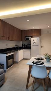 Una cocina o cocineta en Alberti 360 Confort Vista y Sensación de Hogar
