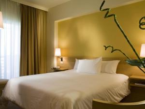 Voodi või voodid majutusasutuse Novotel Cairo 6th Of October toas +88 fotot