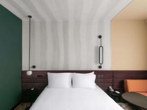 Ένα ή περισσότερα κρεβάτια σε δωμάτιο στο Novotel Cairo 6th Of October +82 φωτογραφίες