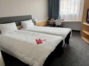 Postel nebo postele na pokoji v ubytování Ibis Katowice - Zabrze + 68 fotografií