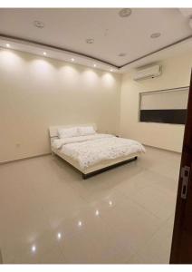 En eller flere senge i et værelse på منتجع ايلين السياحي