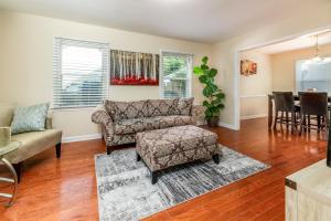 a living room with a couch and a chair at Space of Peace in Charlotte