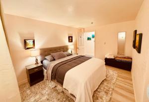 a bedroom with a large bed and two lamps at Fishermens paradise in Forks