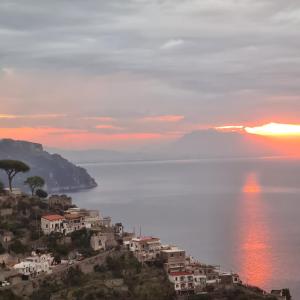 a view of a town on a hill with the ocean at Tenuta Rispoli Amalfi vacationhouse in Amalfi