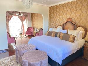 Ένα ή περισσότερα κρεβάτια σε δωμάτιο στο GBL Reine Chateau