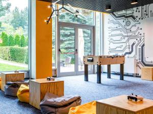 a room with a ping pong table in it at Mercure Karpacz Skalny in Karpacz