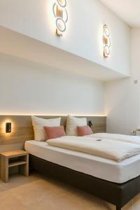 a bedroom with a large bed in a room at Hotel Kalenborner Höhe in Kalenborn