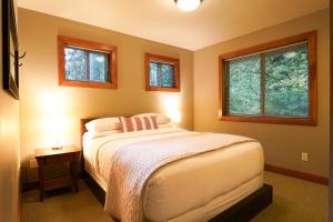 Ένα ή περισσότερα κρεβάτια σε δωμάτιο στο Avventura Chalet