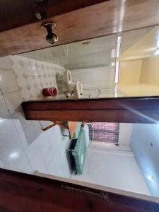 a reflection of a bathroom sink in a mirror at HOTEL CARMELITAS 42 in Villahermosa