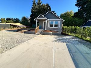 a house with a driveway in front of it at Colorful Comfort 3 Bedroom Home with Fenced yard in Vancouver
