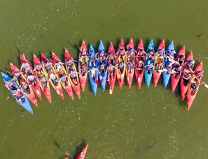 a group of people in boats in the water at Willa Amber Zakościele in Inowłódz