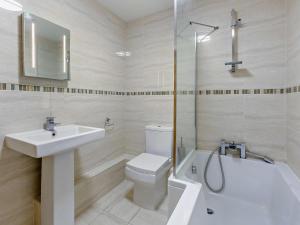 a bathroom with a sink and a toilet and a shower at 5 Bed in Newquay 46489 in Truro +23 photos