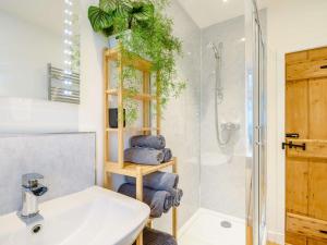a bathroom with a sink and a shower at 3 Bed in Lockerbie 89406 in Lockerbie +38 photos