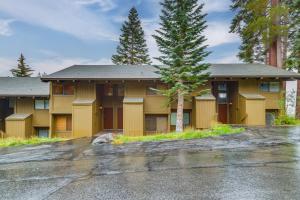 a yellow building with a tree in front of it at Walk to Ski Lift Mtn-View Condo in Mammoth Lakes in Mammoth Lakes