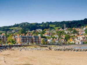 a view of a beach with a town in the background at 1 Bed in Kilve KILVE in Kilve