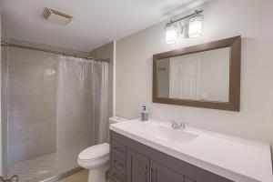 a bathroom with a sink and a toilet and a shower at Luxurious 3-Bedroom House w Priv Pool Game Room in Delray Beach