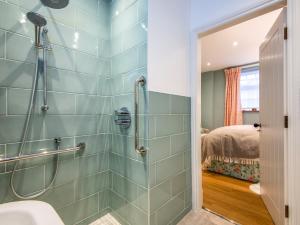 a bathroom with a shower and a sink at 5 bed in Llangollen 77696 in Whitchurch +51 photos